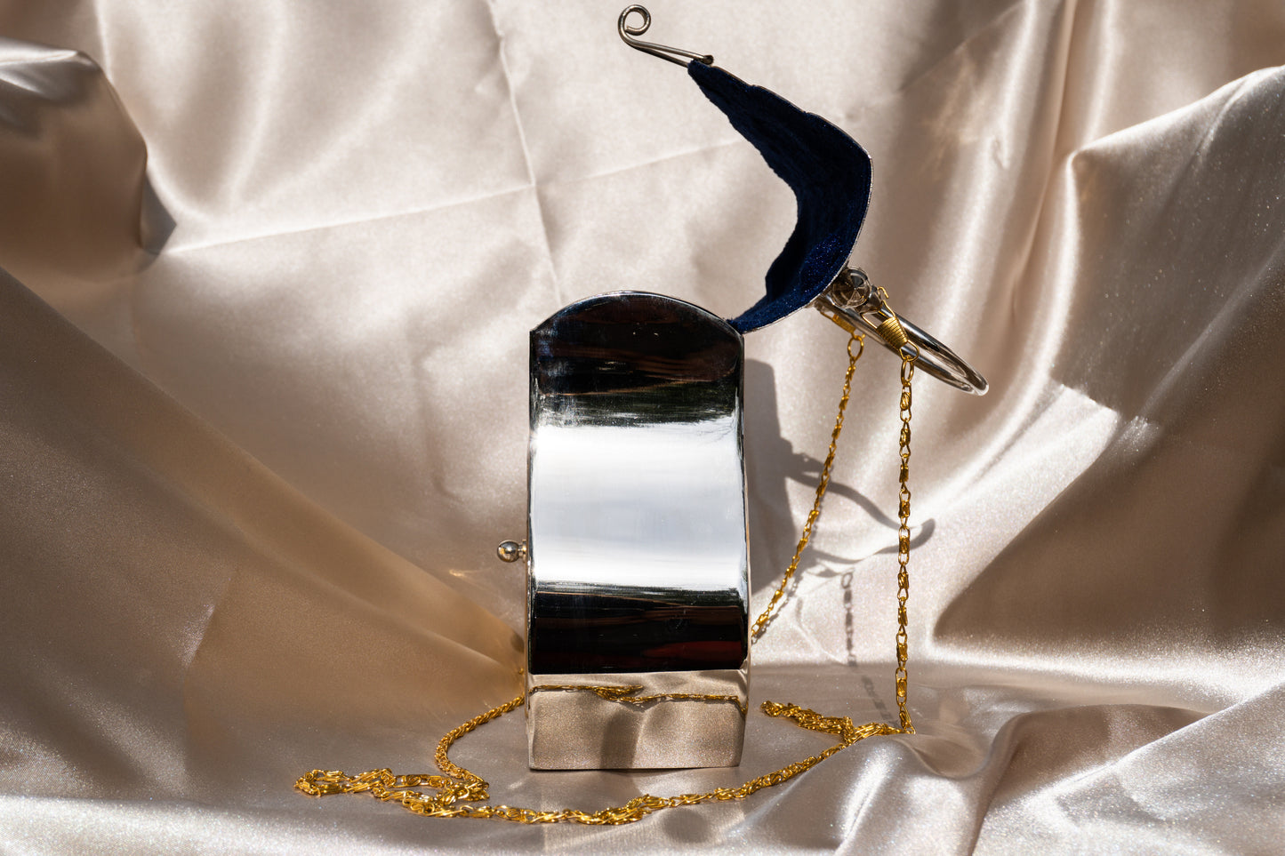 Ida - Handmade Bag, close-up side view with open blue velvet interior and chain